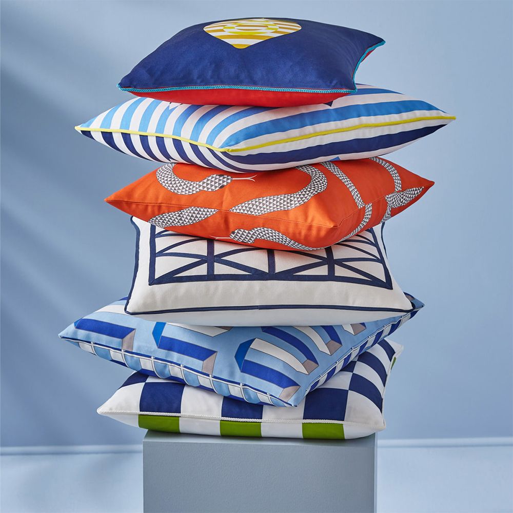 A bold and beautiful blue cushion by Jonathan Adler with a graphic and reversible design