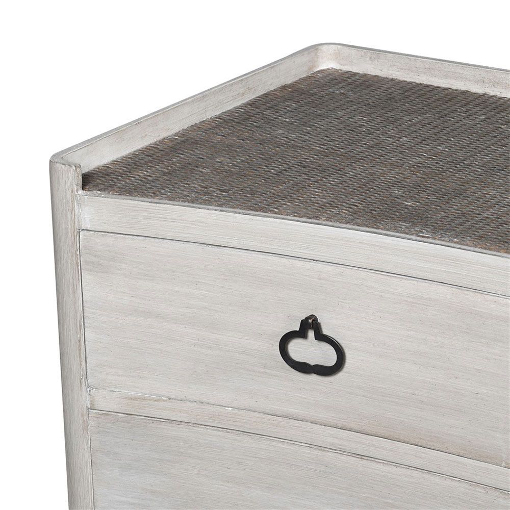 Stylish Scandi-inspired chest of drawers with tasteful rattan surface