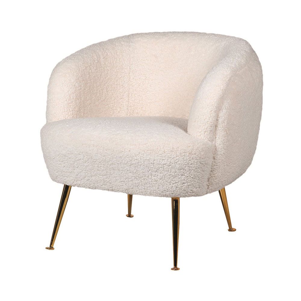 A luxurious contemporary armchair with faux shearling upholstery and golden, tapered legs