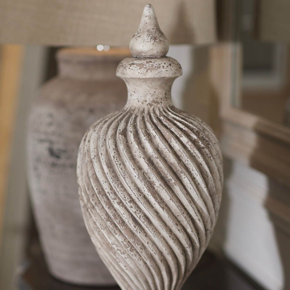 Elegant, distressed finial sculpture with elegant wave pattern 