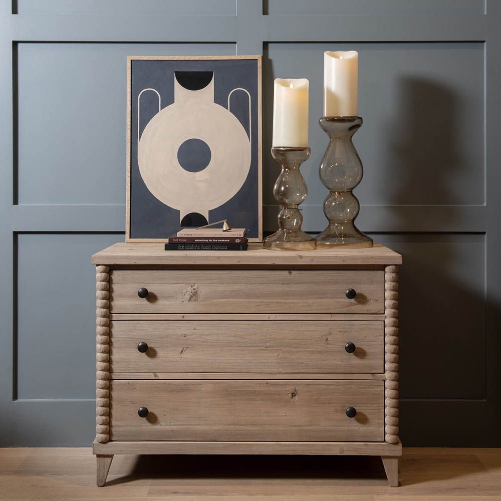 Natural wood chest of drawers with bobbled edges