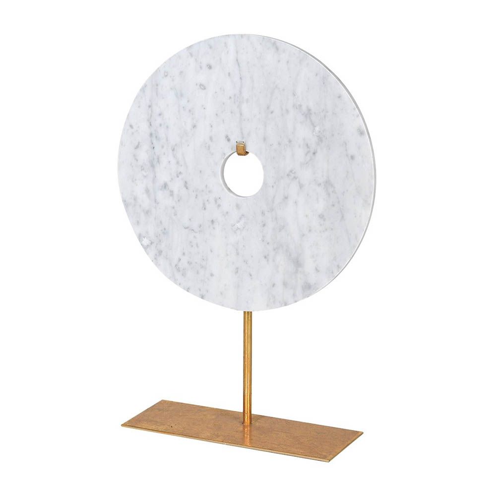 white marble disk elegantly displayed on a gold stand