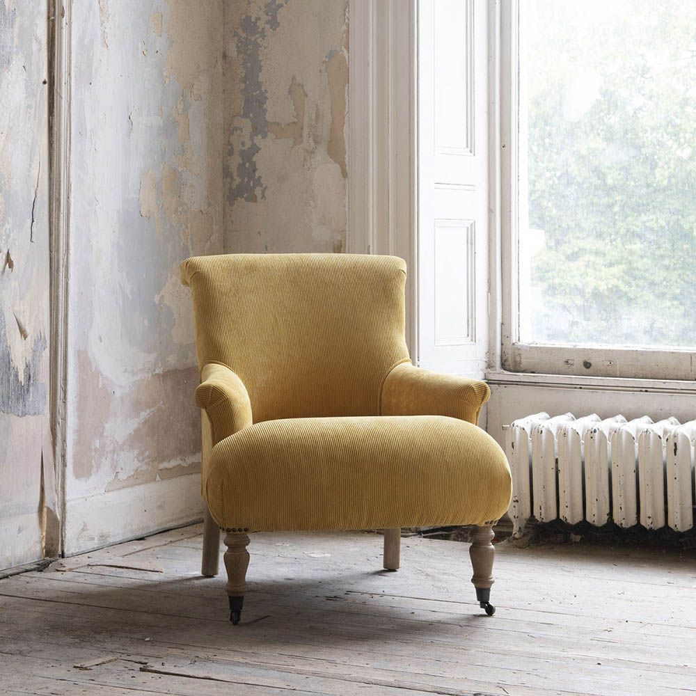 Classical design armchair with yellow cord upholstery 