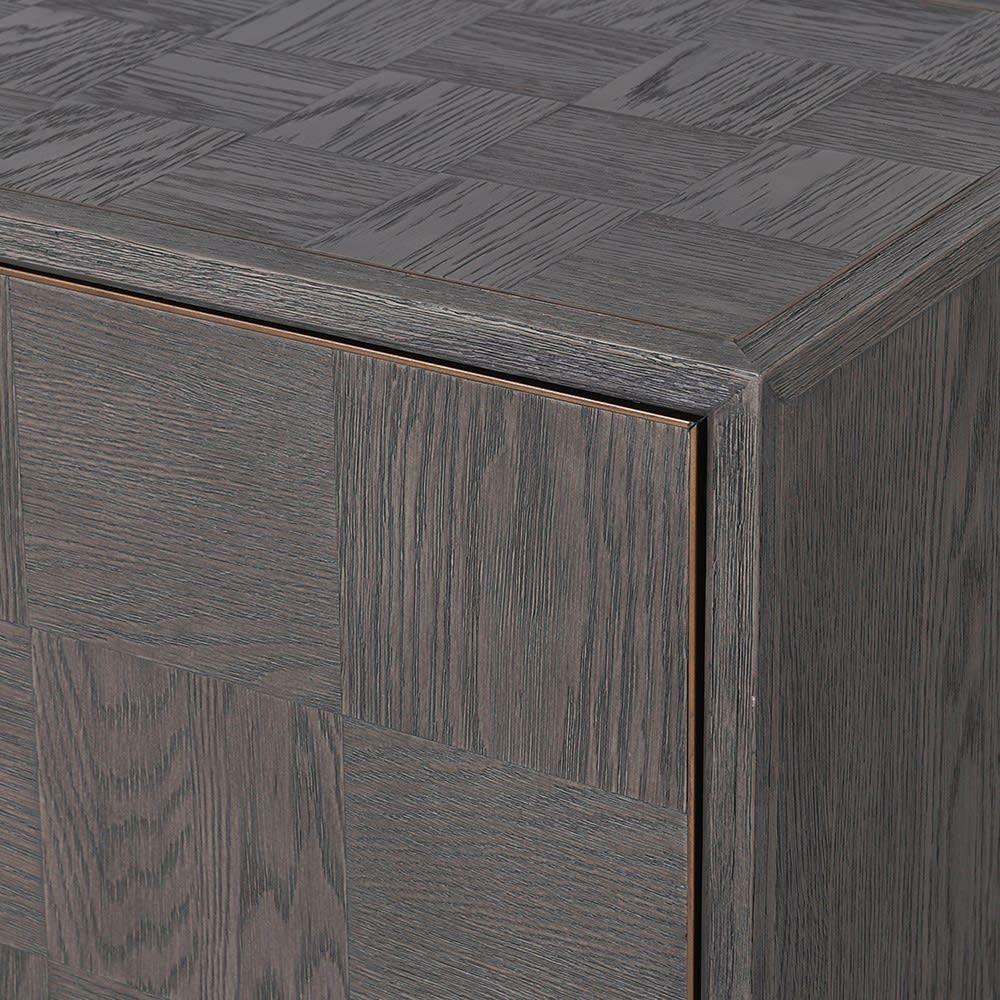 A luxurious 2 door cabinet with interior shelving and antique brass accents