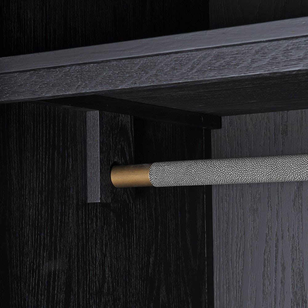 A stunning grey shagreen wardrobe with black and gold accents