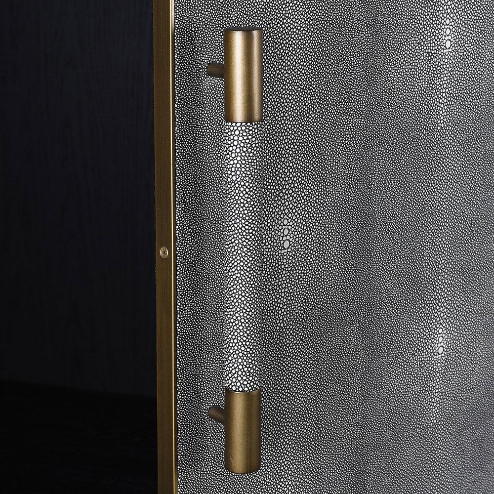 A stunning grey shagreen wardrobe with black and gold accents