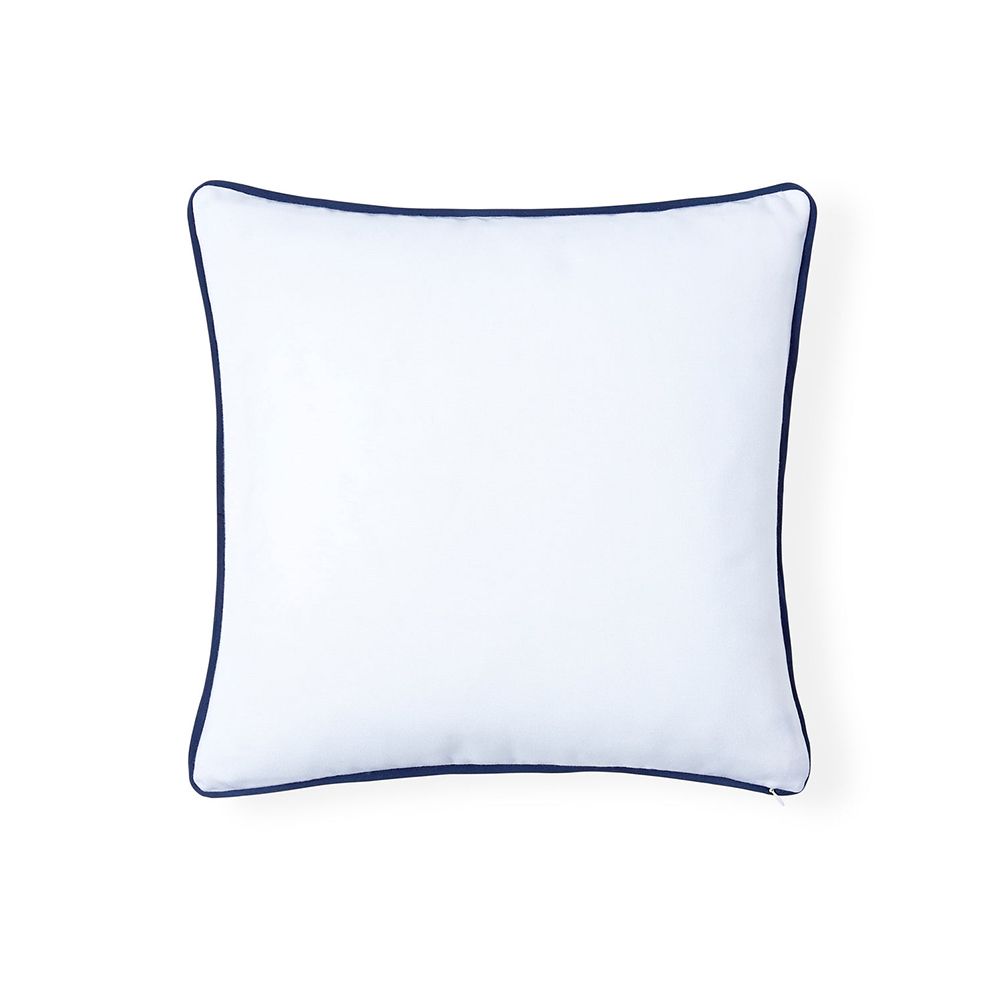 A stylish cushion by Jonathan Adler with a pattern formed from navy, raised ribbon embroidery on a ivory cover