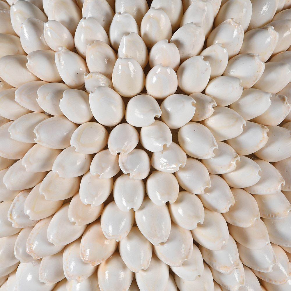 decorative ball covered in individual ivory shells