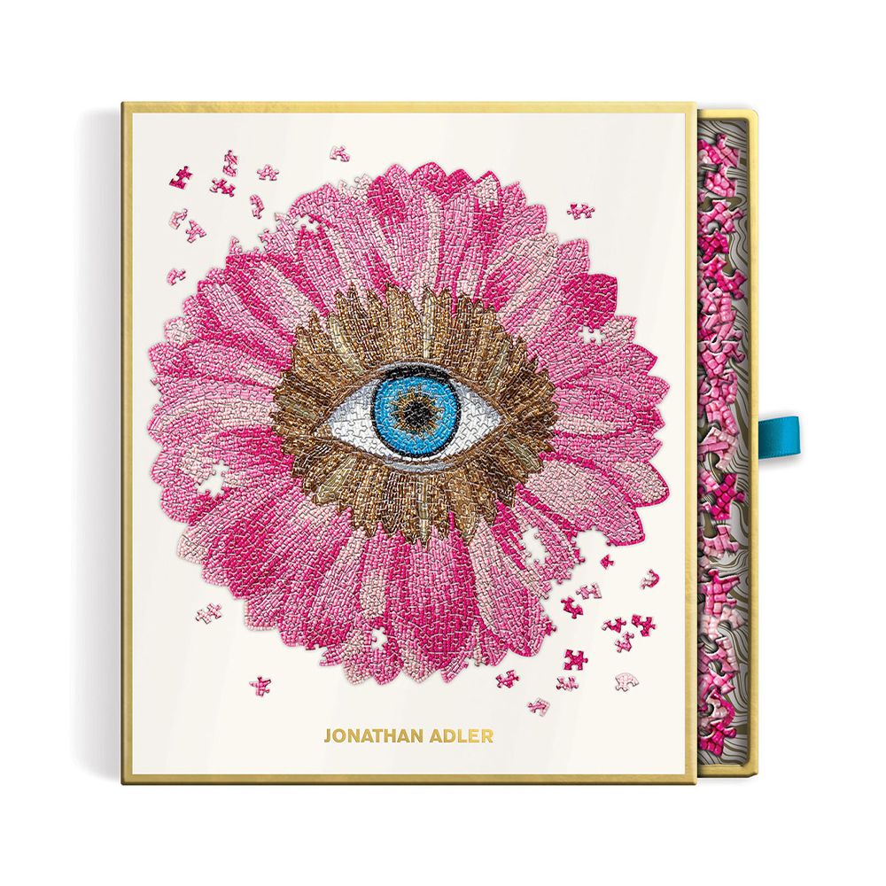 A luxury petals shaped puzzle by Jonathan Adler with 750 pieces and glamorous gold foil accents