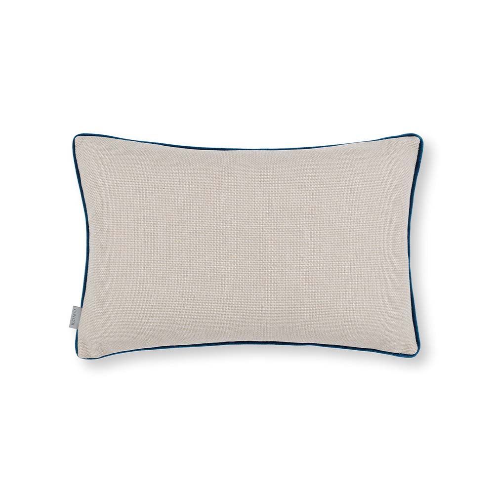 A multi-coloured, velvet cushion with teal piping.