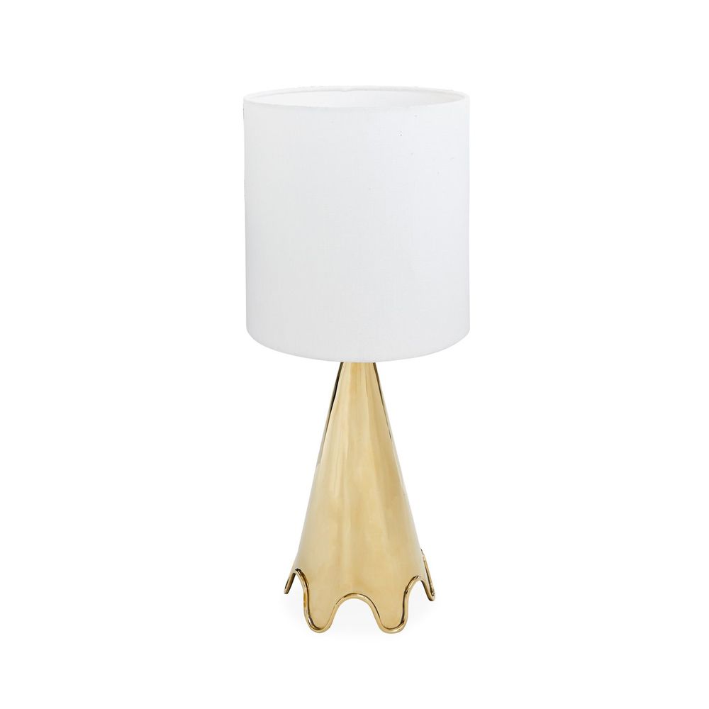 A luxurious, solid polished brass table lamp with a rippled base and a white shade