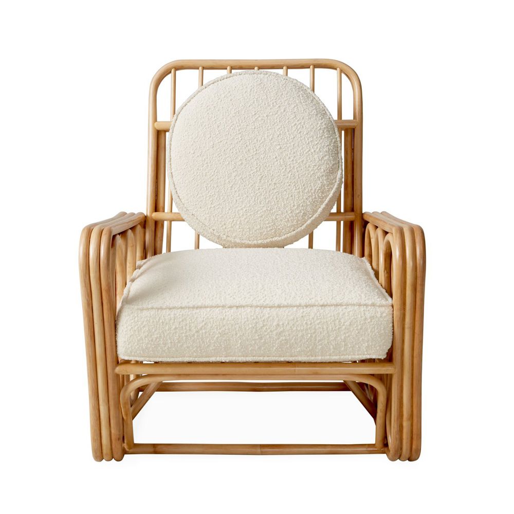 A luxurious rattan and boucle lounge chair by Jonathan Adler