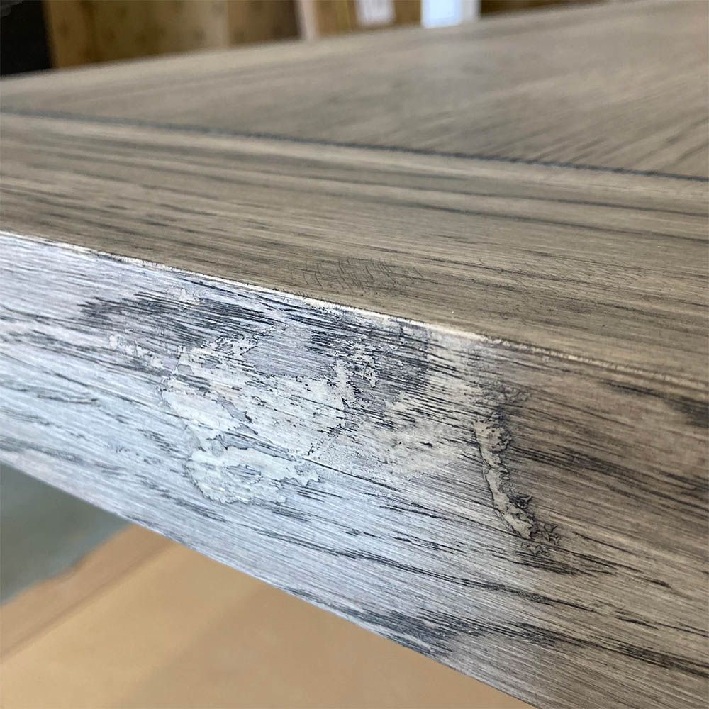 Minor mark to the side of the table