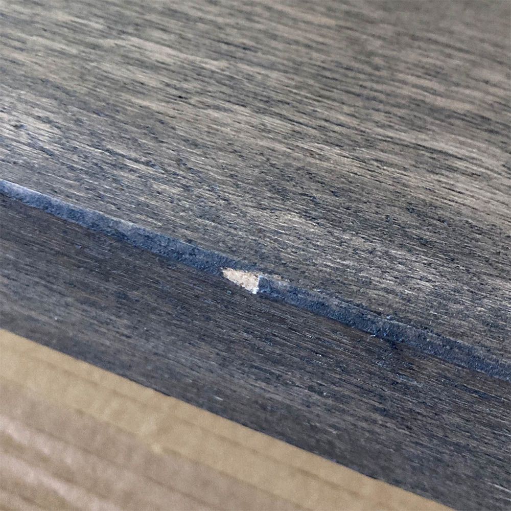 Minor scratch to the side of the table
