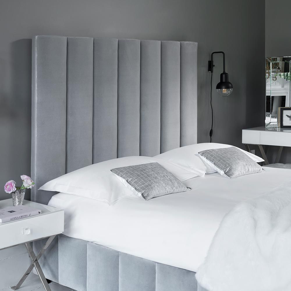 Art deco chic style bed with a towering deep fluted panel headboard 