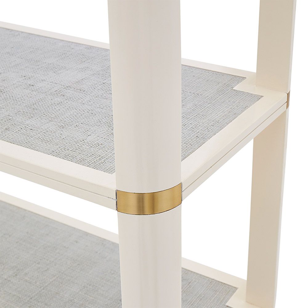 A luxurious Ivory lacquer-coated mahogany etagere with brass cuff details
