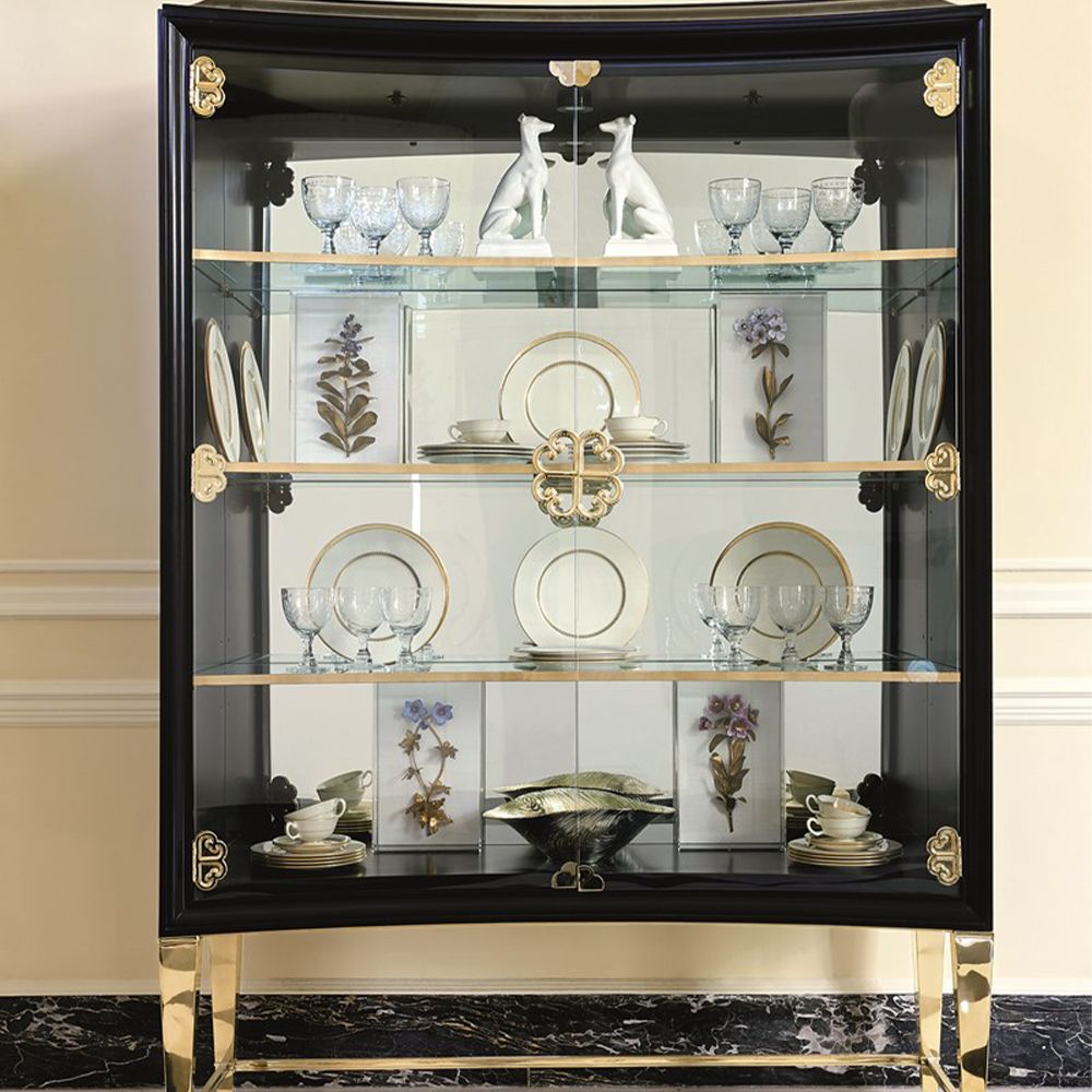 A luxury display cabinet from Caracole with glamorous gold details