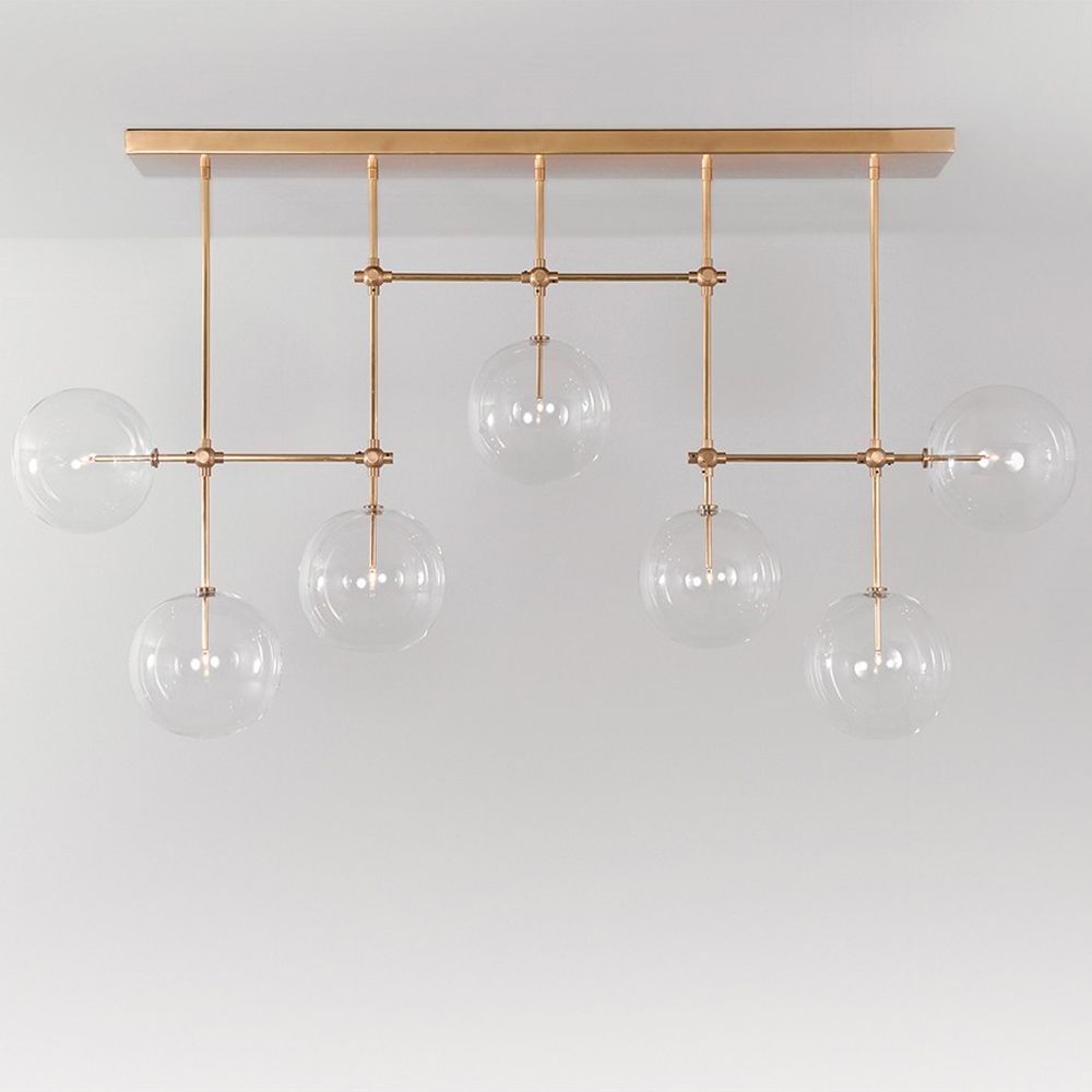 Natural brass finish industrial style chandelier with hanging clear glass globes
