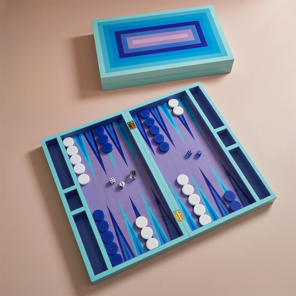 A luxury backgammon set by Jonathan Adler with a glossy finish and shades of blue and lavender