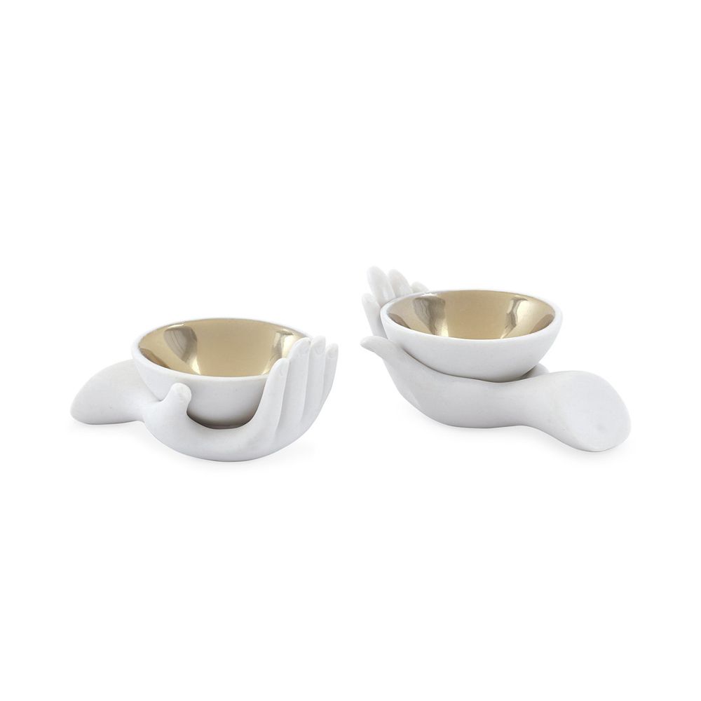 a pair of stylish matte porcelain and gold salt and pepper cellars