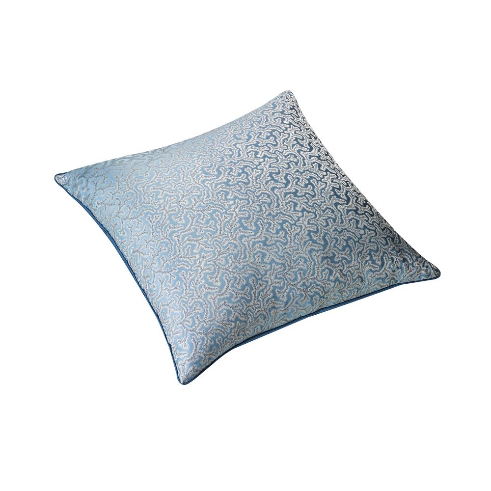 This luxurious, blue silk cushion features an elaborate, jacquard pattern with tailored piping along the edges. 