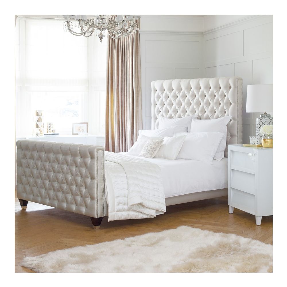 Luxury deep buttoned bed with silver studding and dark feet