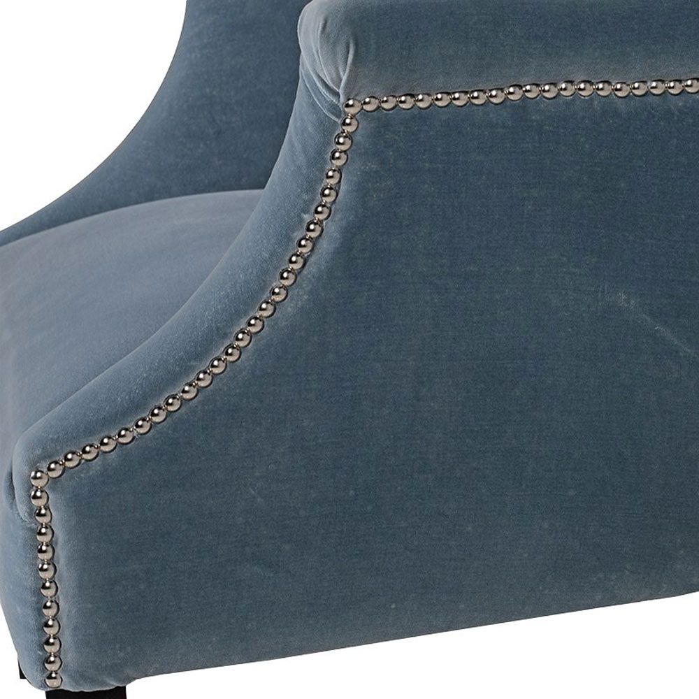 sky blue armchair with silver studding and black legs 
