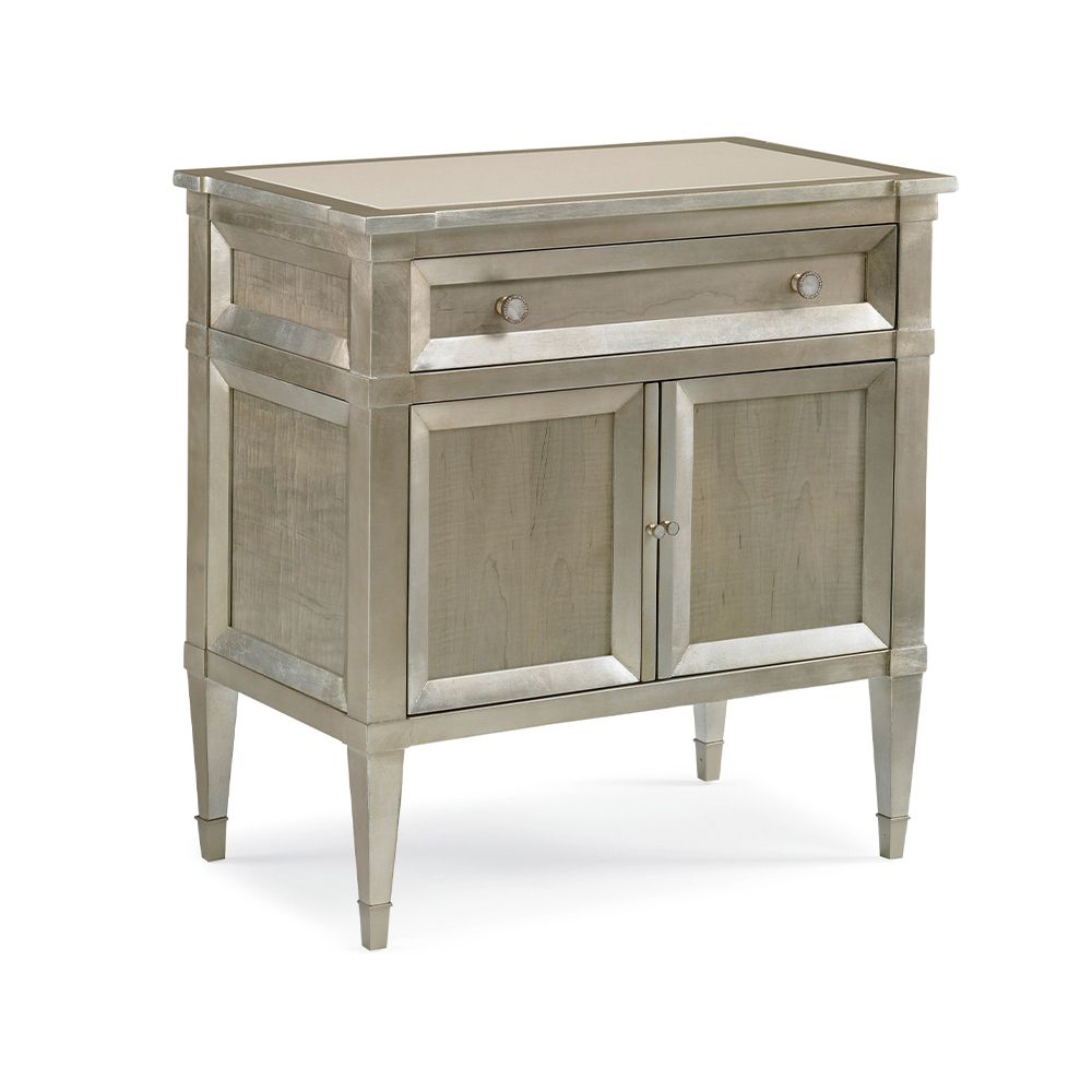 A glamorous bedside table by Caracole with jewellery-like hardware