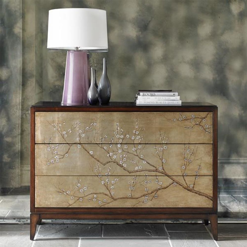 An elegant chest of drawers by Caracole with a beautiful blossom pattern and Swarovski crystals