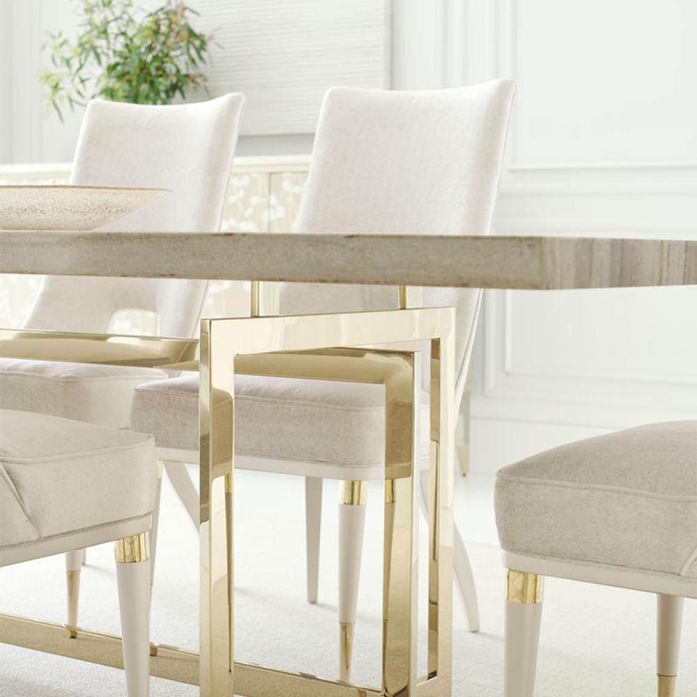 Neutral upholstered dining room chair with peak-through lower back