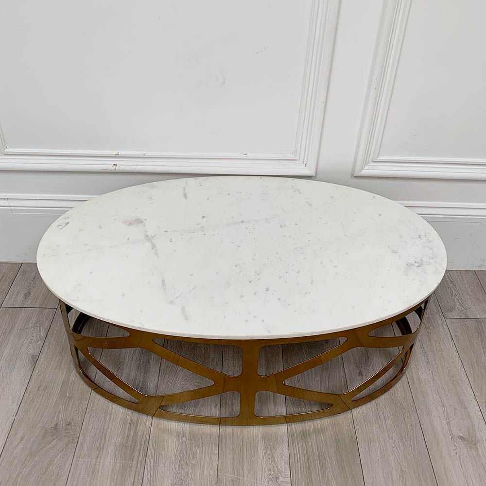A chic white marble and brass coffee table