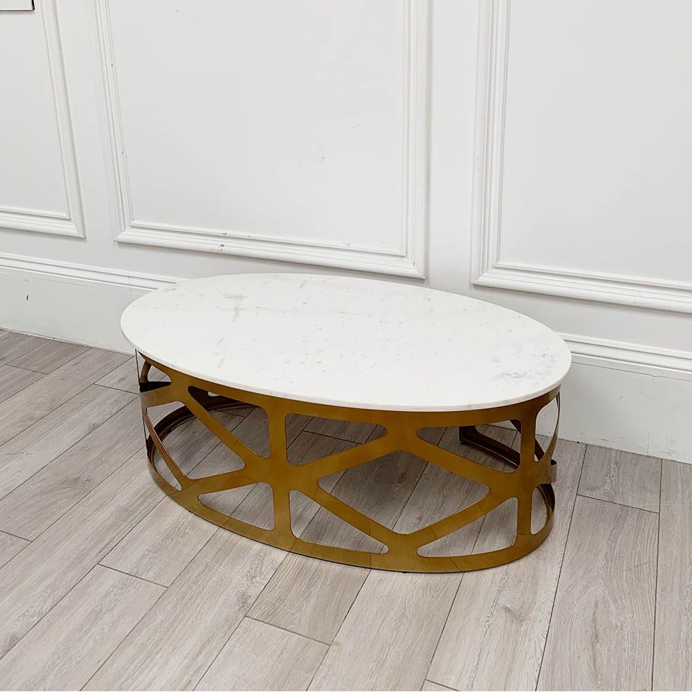 A chic white marble and brass coffee table