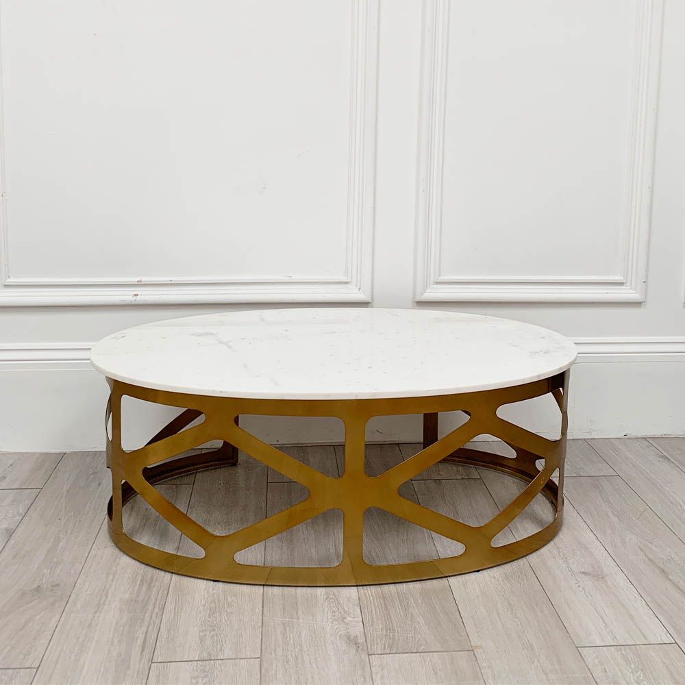 A chic white marble and brass coffee table