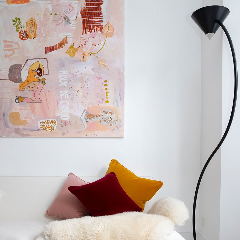 A stylish velvet cushion with a mustard colour and square shape