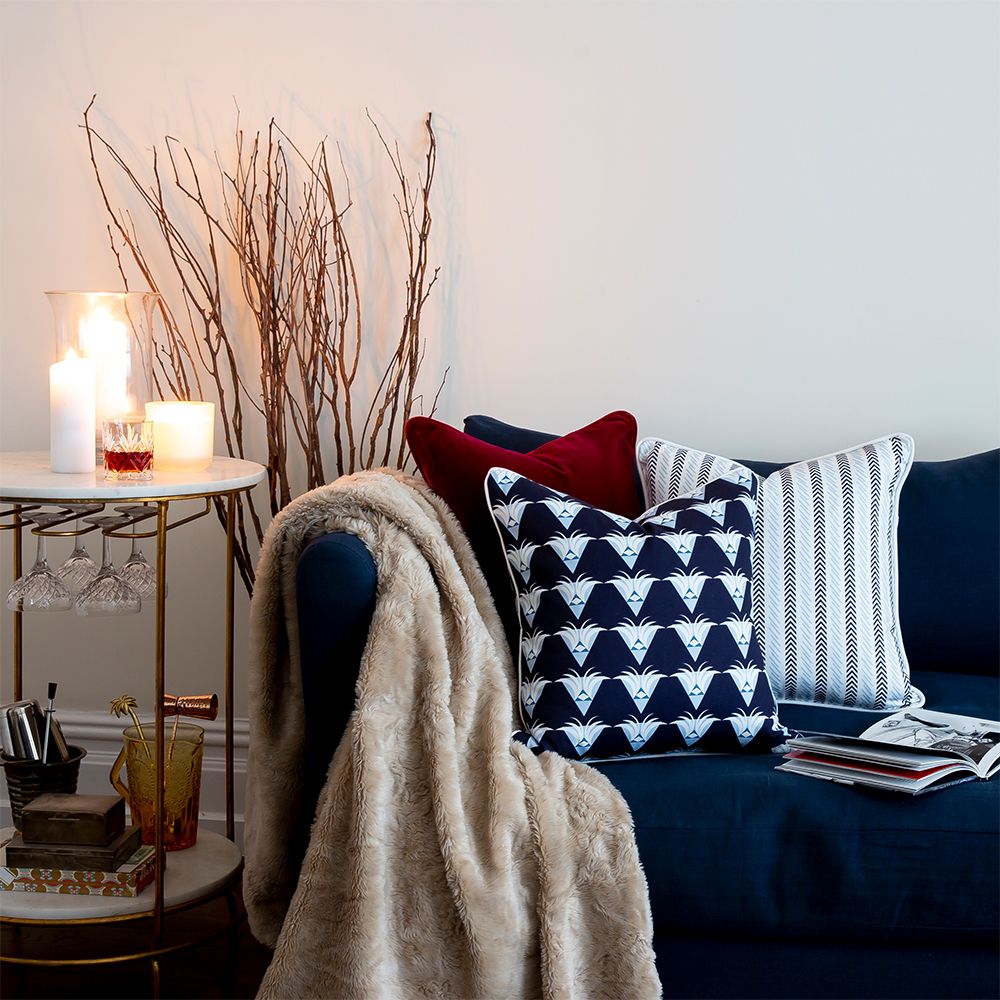 A rich and luxurious cranberry red velvet cushion 