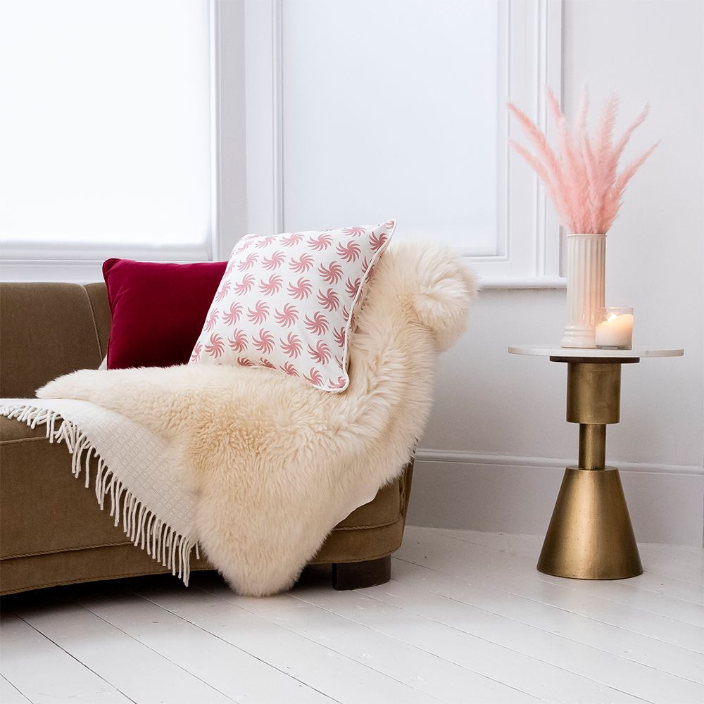A rich and luxurious cranberry red velvet cushion 