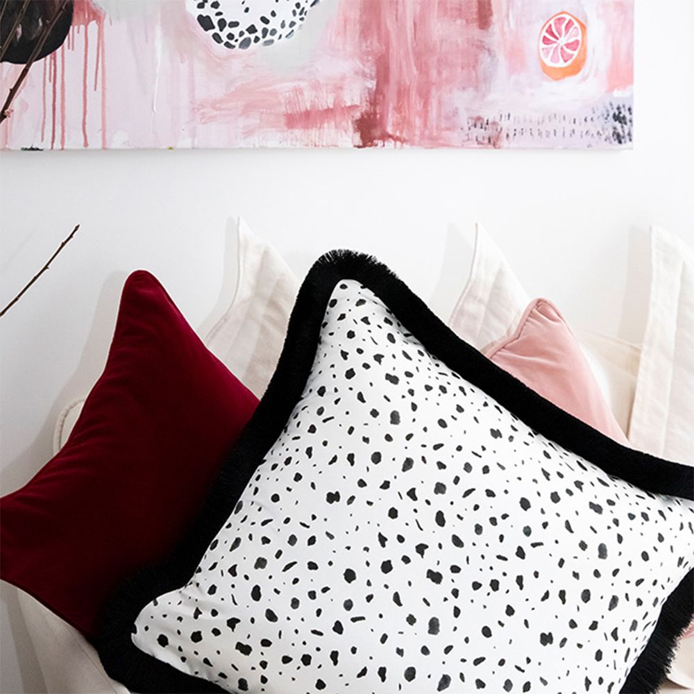 A rich and luxurious cranberry red velvet cushion 