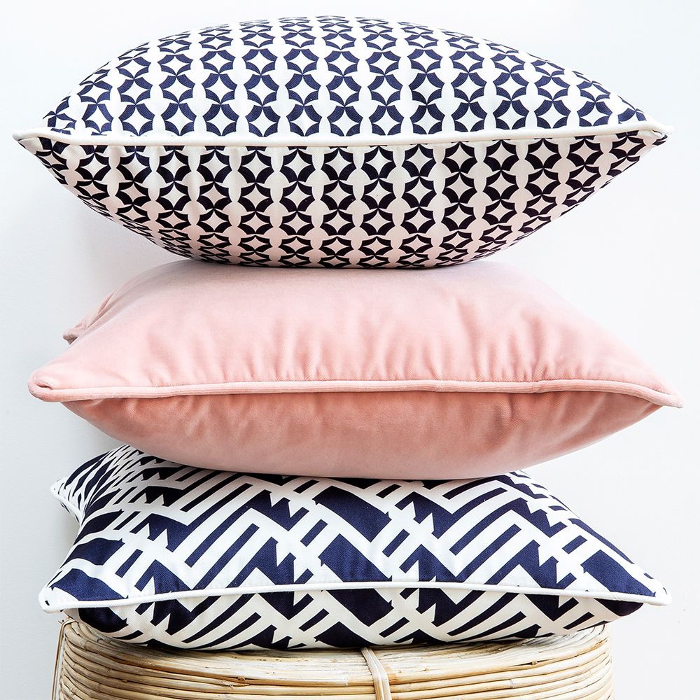 A lovely light pink velvet square shaped cushion 