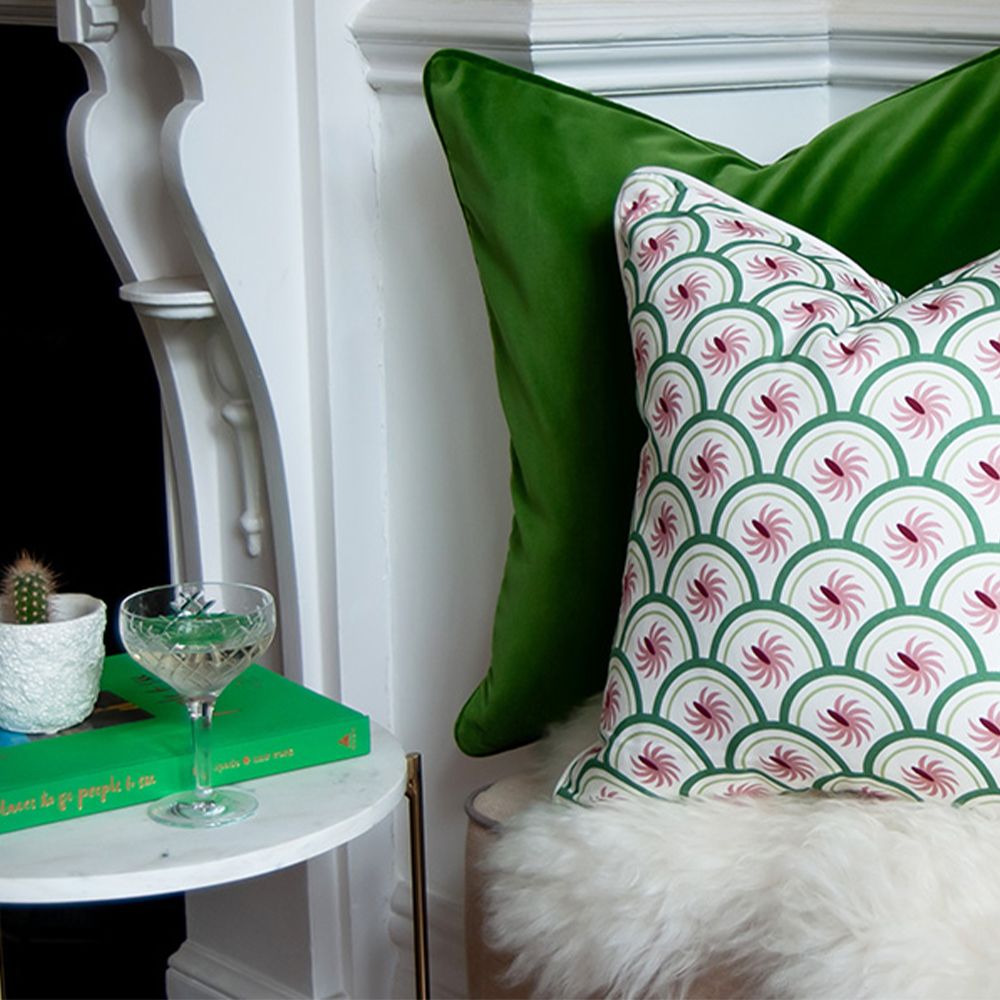 A rich dark green velvet cushion 