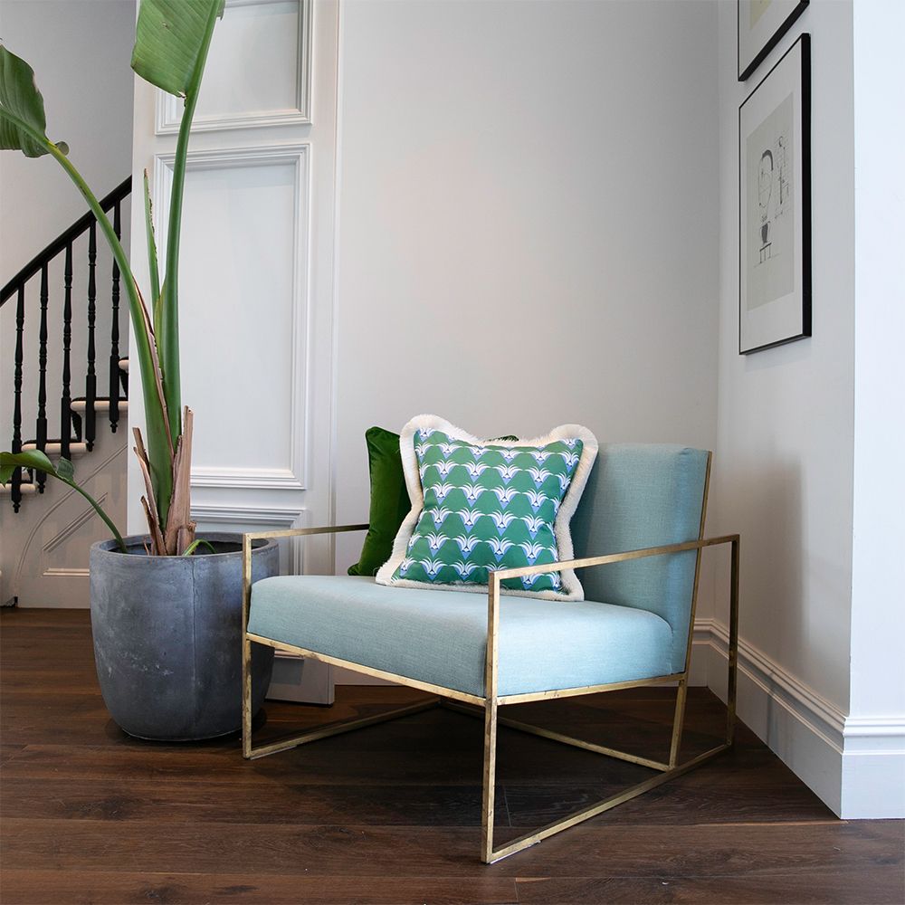 A rich dark green velvet cushion 