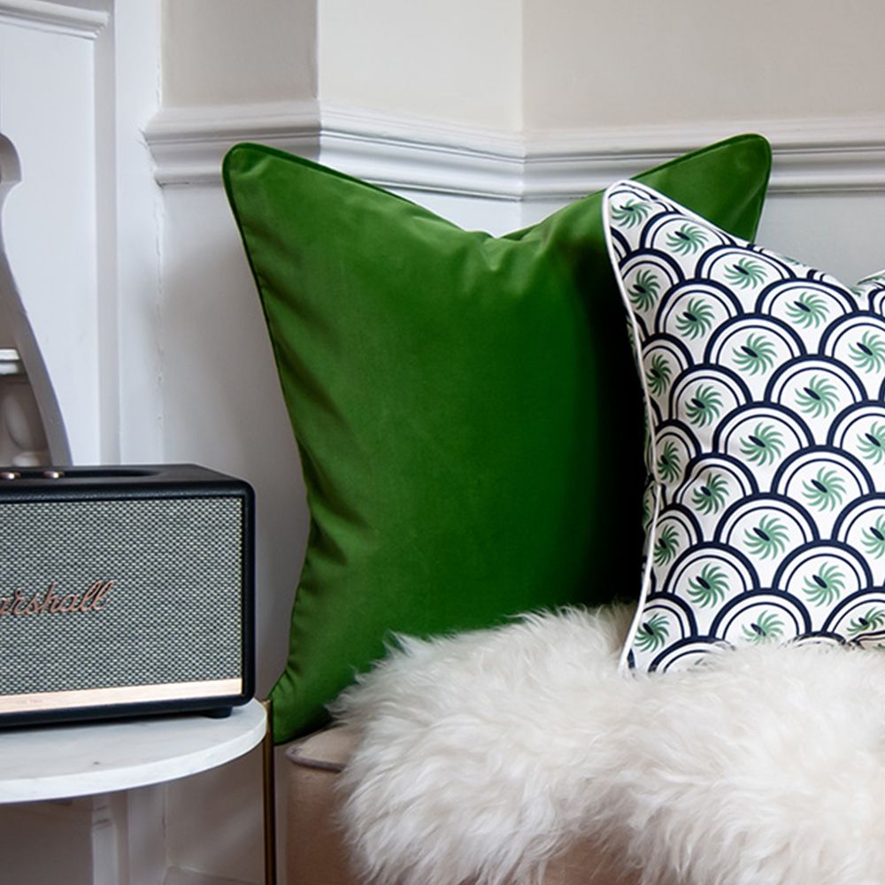 A rich dark green velvet cushion 