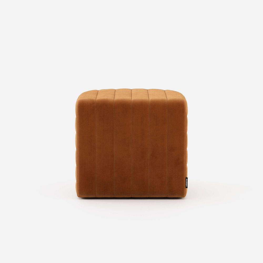 Luxury velvet pouffe with padded, ribbed design