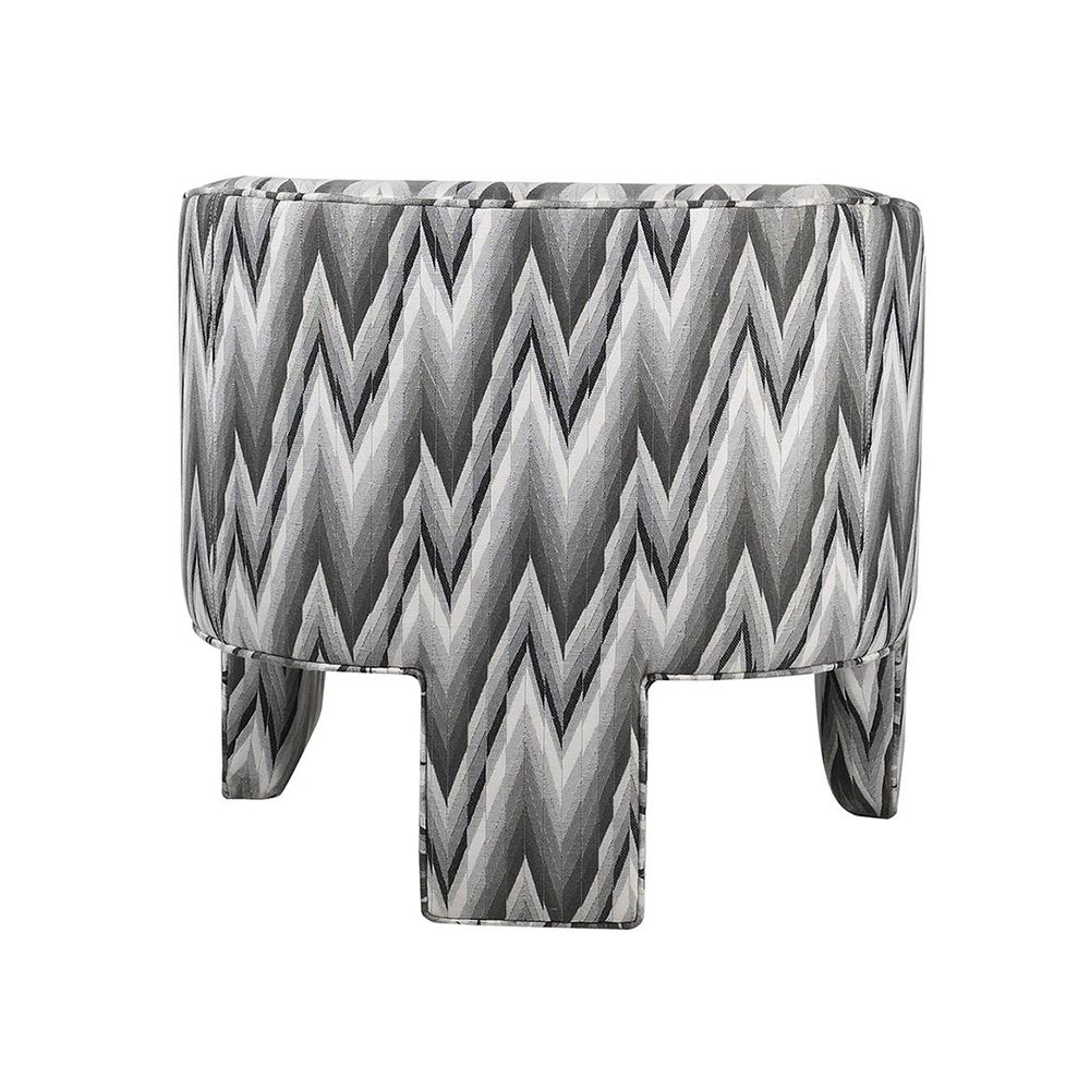 A quirky patterned armchair with a gorgeous grey upholstery 