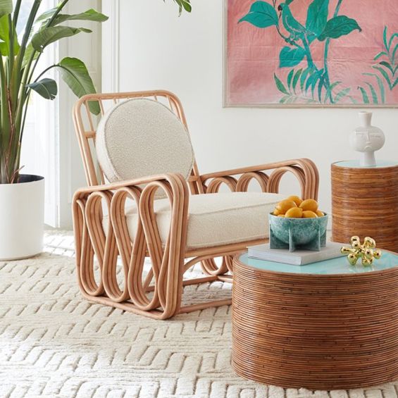 A luxurious rattan and boucle lounge chair by Jonathan Adler