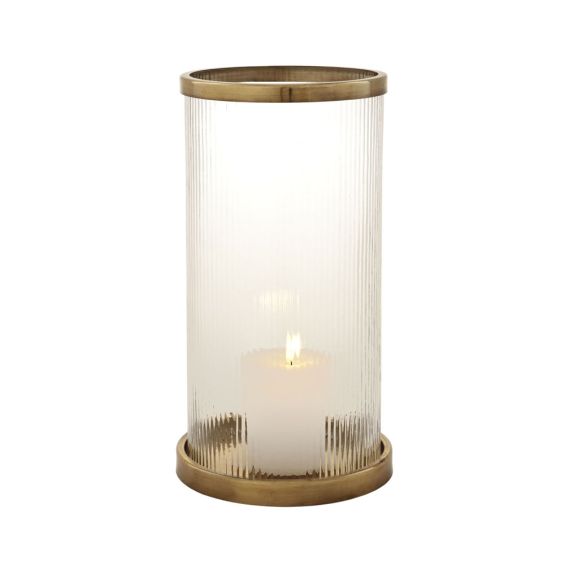 An elegant, large glass candle holder with an antique brass base and rim