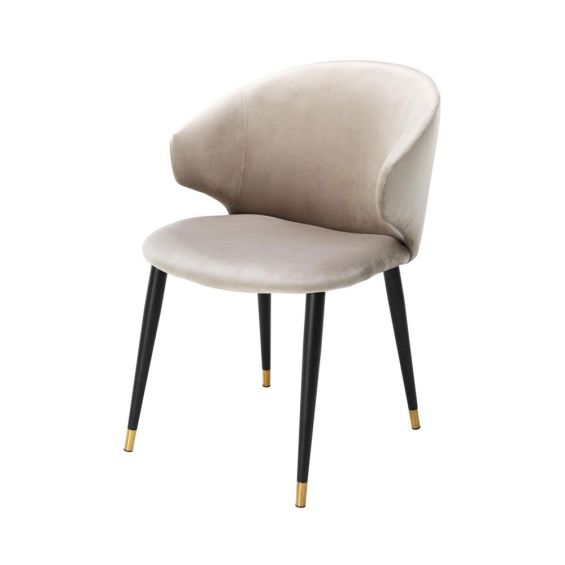 Luxury beige velvet dining chair with black and gold tapered legs
