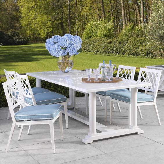 white outdoor dining chair with blue and white cushion