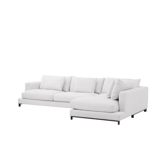 A luxurious white contemporary lounge sofa with scatter cushions