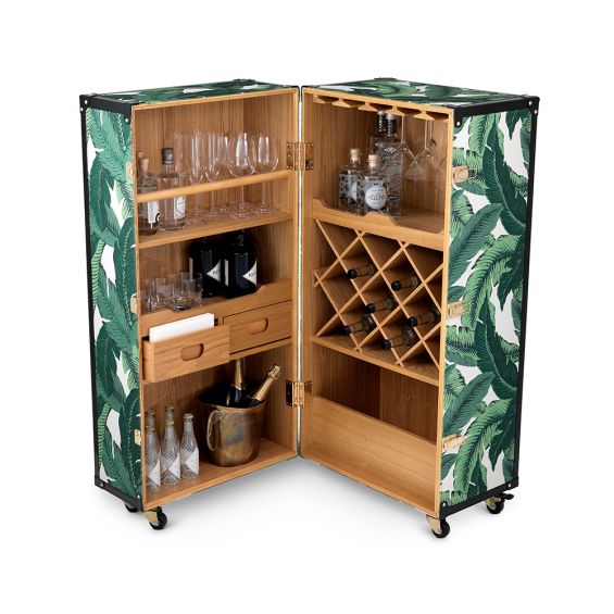 A stylish wine cabinet by Eichholtz with a mustique green fabric upholstery