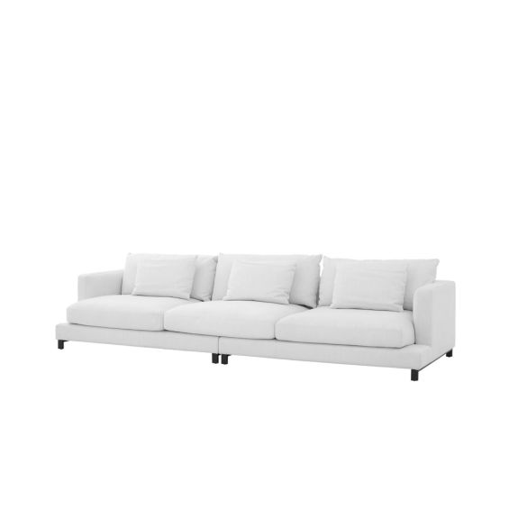 A contemporary white sofa with contrasting black legs 